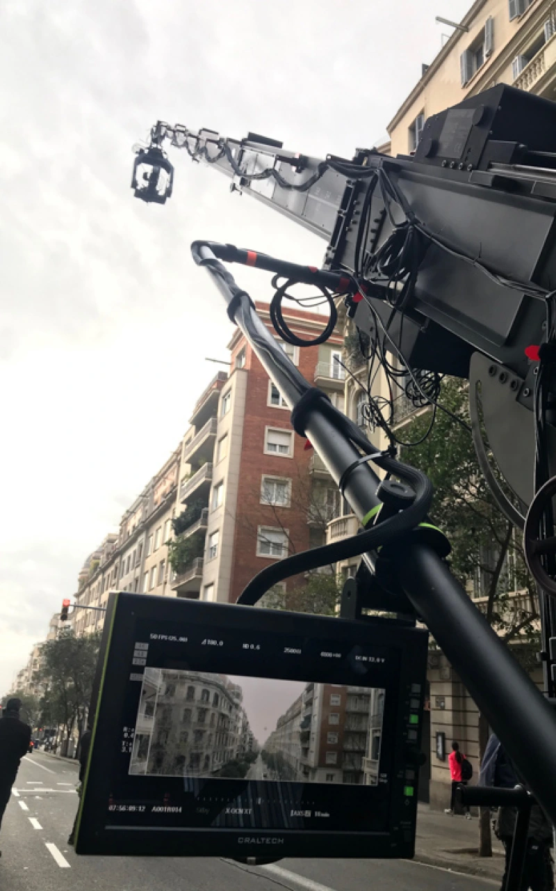 Camera crane and monitor framing a city street during a DotFive shoot by Glassy Films