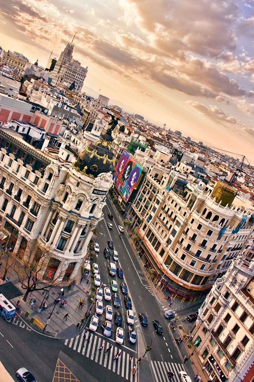 Aerial view of Gran Vía and the Metrópolis building in Madrid at sunset