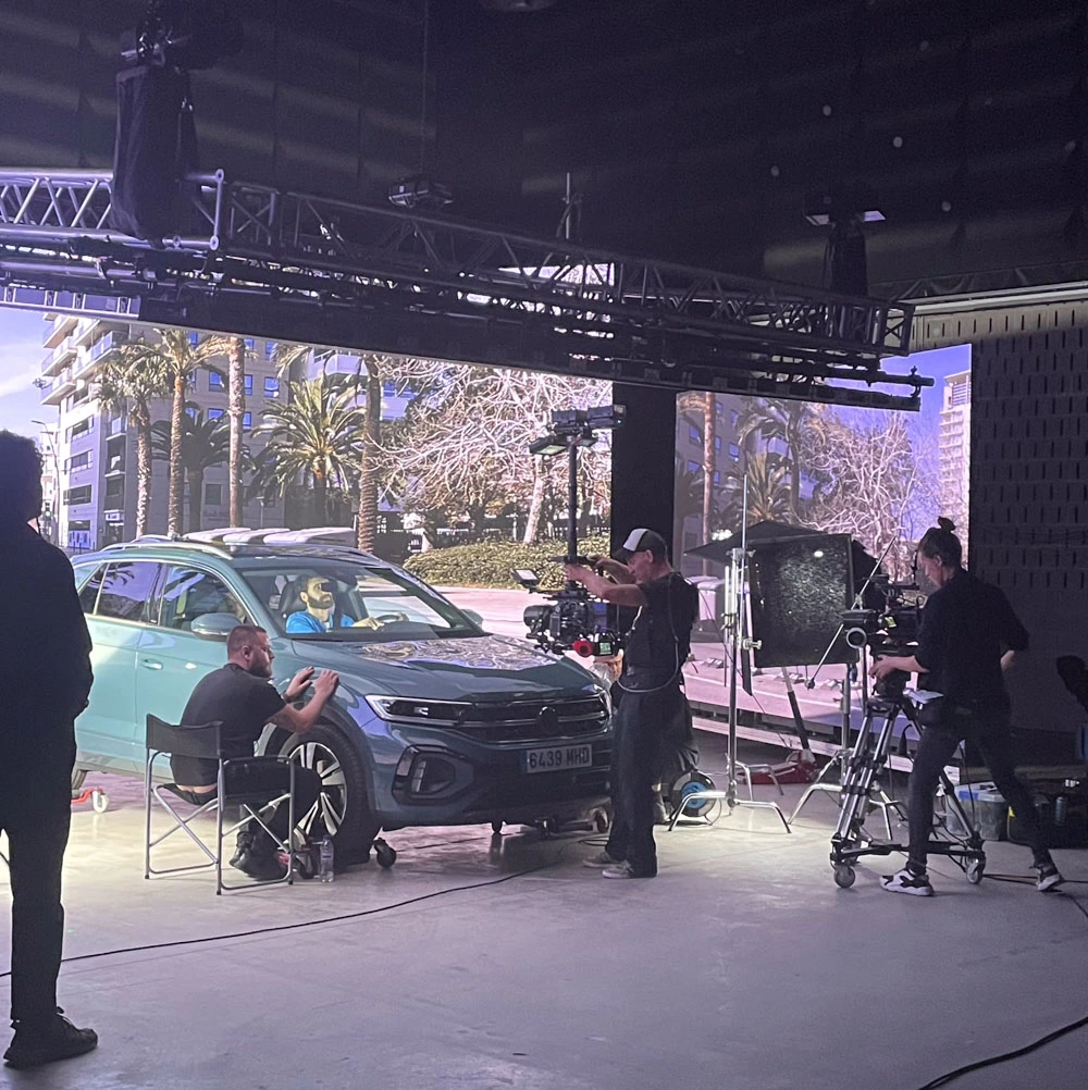 Glassy Films crew filming an SUV on an LED virtual production stage
