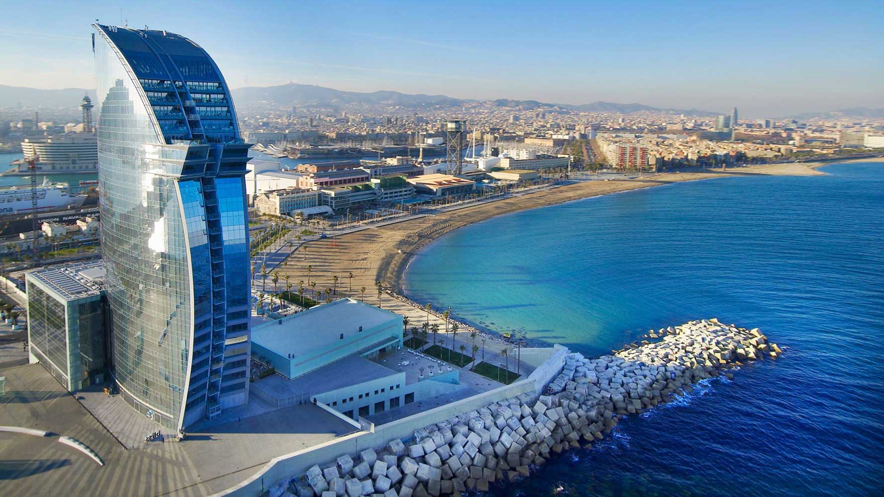 Aerial view of the Barcelona seafront, its beach and the W Hotel