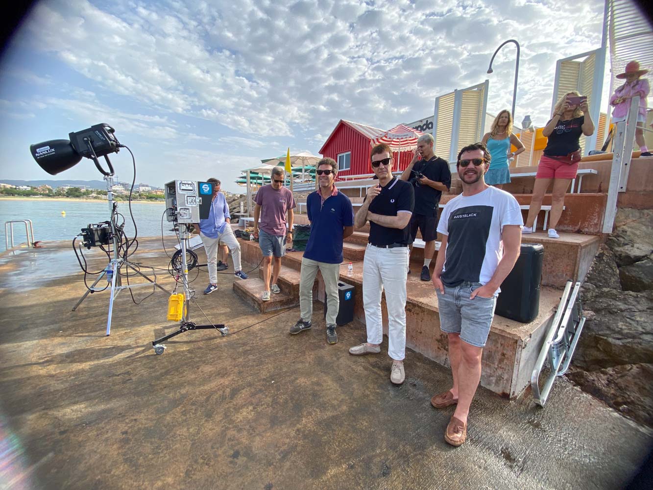 Glassy Films crew and lights on a seaside terrace during a DotFive shoot