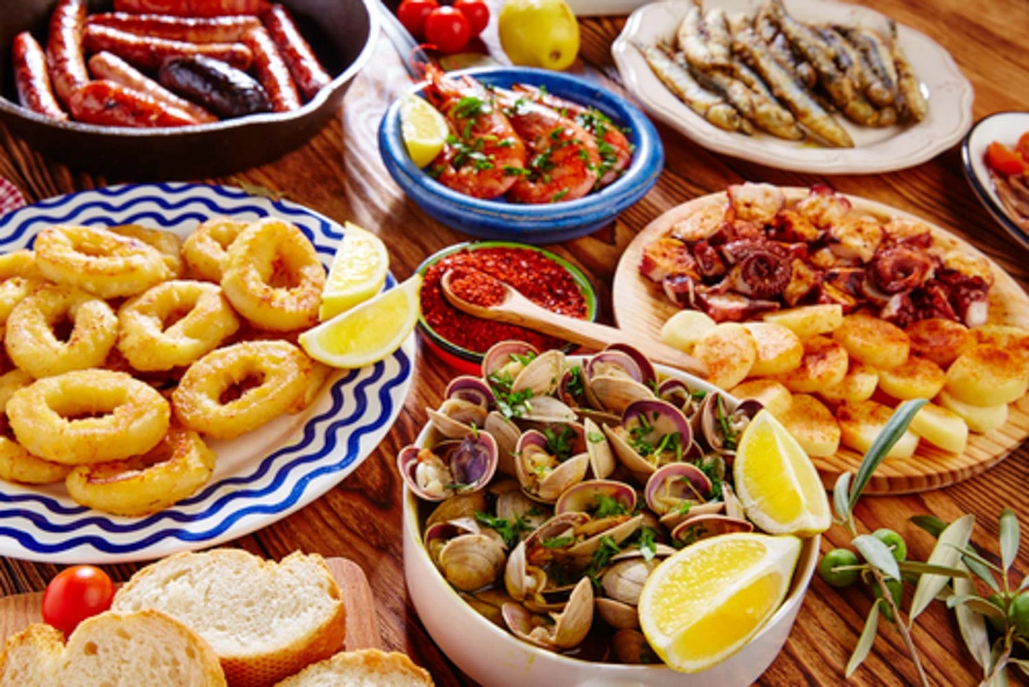 Table of Spanish tapas: calamari, clams, prawns, octopus and chorizo
